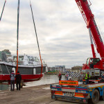 Lifting boat out of the river Lee